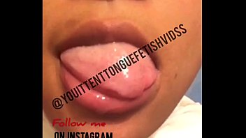 Black whore Drooling on her tits,